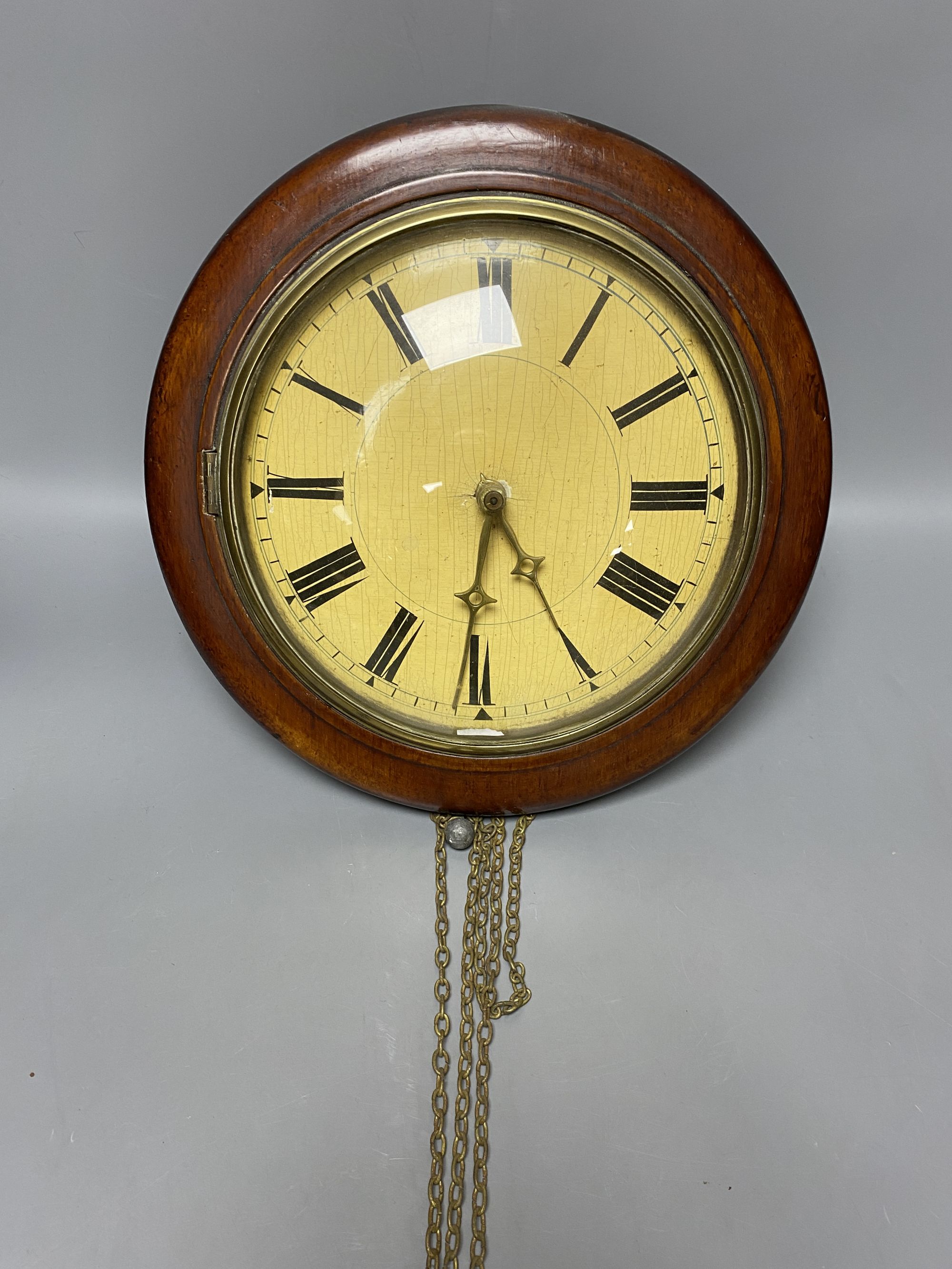 A Black Forest mahogany wall dial clock, diameter 31cm (no weights)